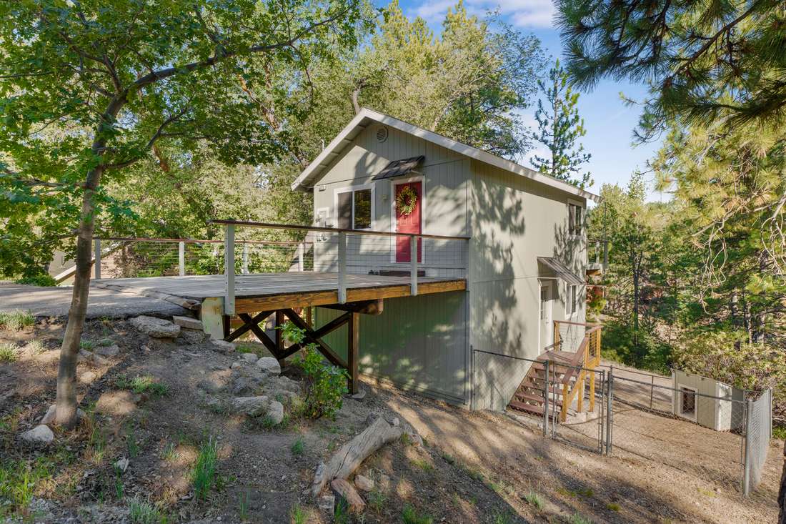 Cabin seen from below its raised deck.